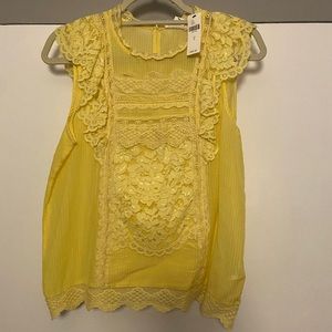 Sleeveless lemon-yellow eyelet lace blouse